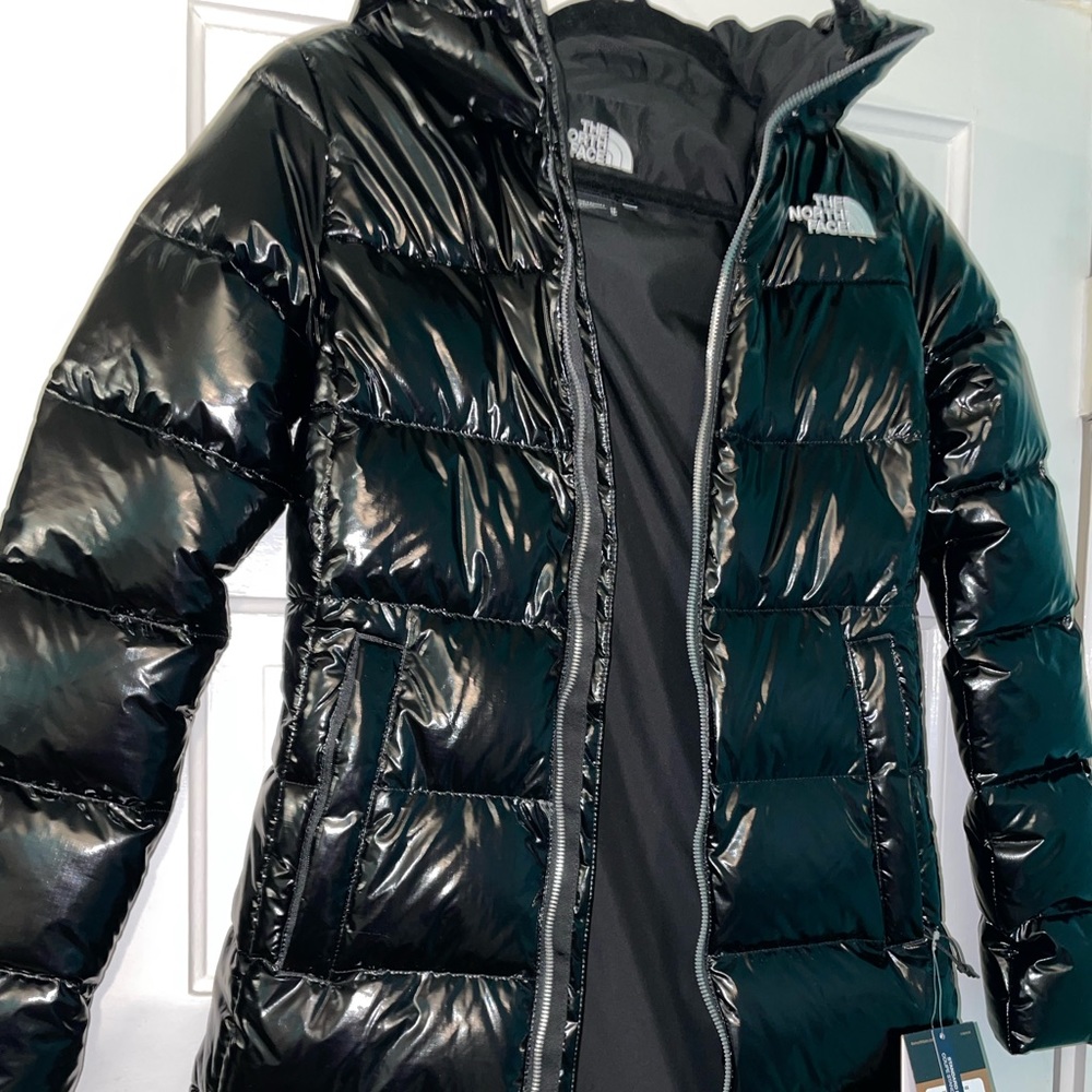 Adorable shiny black long coat. New with tags.
